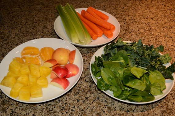 Pineapple, lemon, apple, celery, carrot, spinach, and kale.